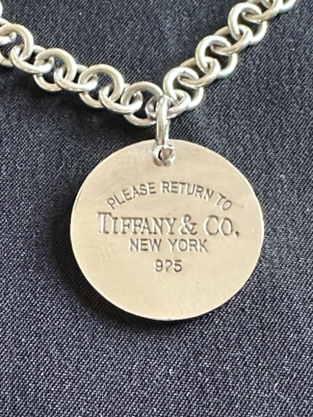 Tiffany silver disk necklace. “Return to Tiffany” stamped 925. 16” chain
